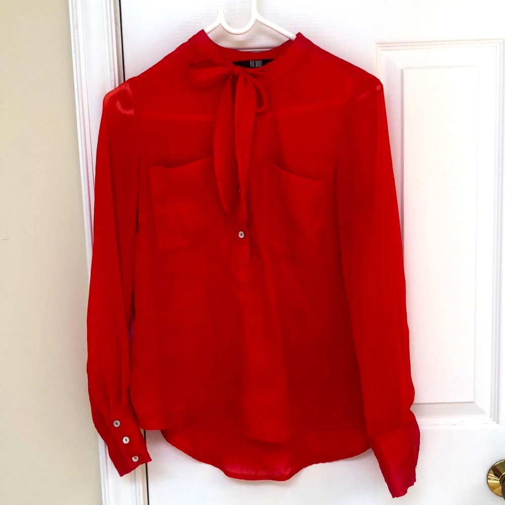 Bright orange pussy-bow blouse